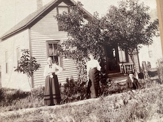 Christina Bengtsdotter Lassen and her daughter, Anna Laura Beatrice Lassen and Laura's husband Edmund Kyler. Taken about 1902-1903 in Ruthton, Minnesota in front of Christina's house.